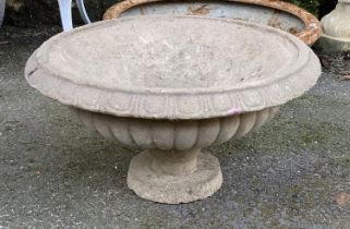 A wide composite stone planter on a low stand, 60cmD, 33cmH
