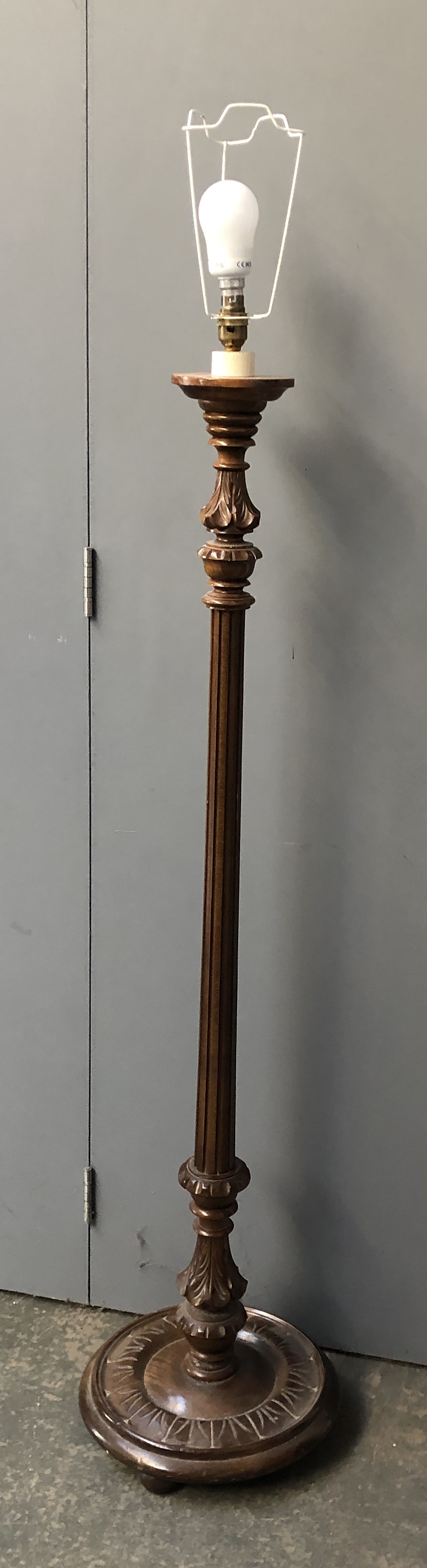 A carved wood standard lamp, 128cmH to base of fitting