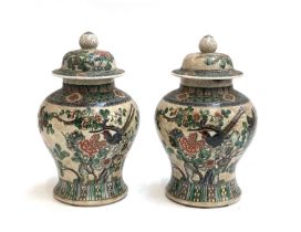 A pair of large Chinese famille verte crackle glaze lidded baluster vases and covers, 34cmH