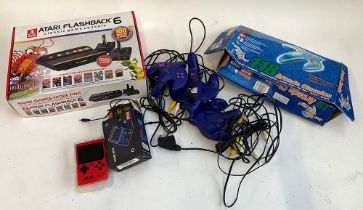 An Atari Flashback 6 classic game console; together with a 'Gamebox' etc
