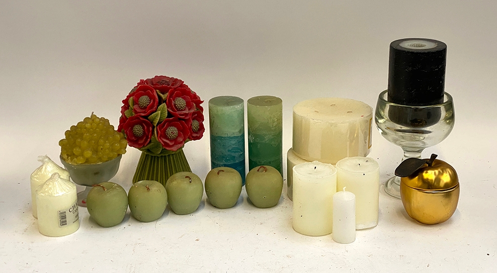 A mixed lot of candles to include novelty large bouquet shaped candle; apple shaped candles etc