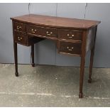 An early 20th century bowfront serving table, with five drawers, 108x52x87cmH