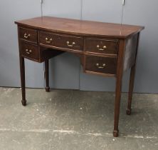 An early 20th century bowfront serving table, with five drawers, 108x52x87cmH