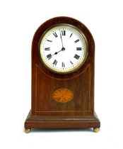 An early 20th century mahogany mantel clock, white enamel dial with Roman numerals, 22cm high