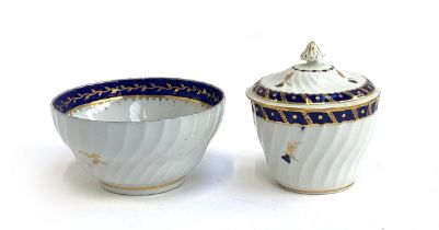 An 18th century Worcester lidded sugar bowl, crescent mark to base, 12cmH; together with a similar