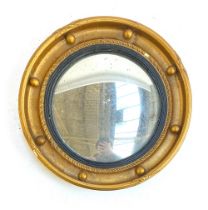 A Regency style convex mirror with bobble moulding, 'A Mirrart Product', 36cmD