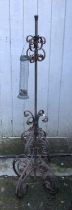 A wrought metal bird feeder stand, approx 128cmH