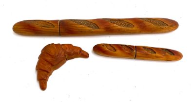 A Cuzini wooden croissant shaped knife, 14cmL together with a similar baguette knife, 22cmL and