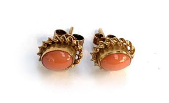 A pair of 9ct gold mounted coral cabochon earrings, 1cmL, gross weight 1.4g