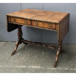 An early 20th century burr walnut and parcel gilt sofa table, on lyre end supports with claw feet,