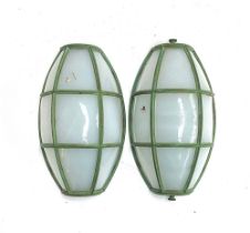 A pair of perspex and verdigris effect wall lights, 27cmH; together with one other af