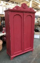 A 19th century pine cupboard, later painted in a deep berry pink, 114x50x202cmH