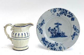 An 18th century Delft plate, 23cmD; together with an early 19th century moulded Pearlware jug (