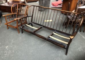 An Ercol style stickback sofa and armchair (cushions missing), the sofa approx. 175cmW