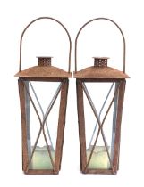 A pair of glazed metal hanging lanterns, 44cmH to top of chimney