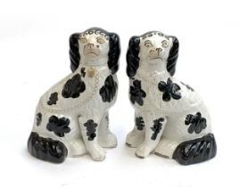 A pair of mid 19th century Staffordshire dogs c.1860 (af), painted with Disraeli curls and