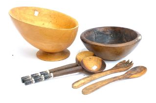 A turned wooden fruit bowl, 30cmD; together with one other, wooden serving spoon etc