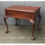 A side table in 18th century style, with single drawer, on acanthus carved cabriole legs on ball and