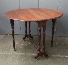 A large oval mahogany Sutherland table, on ceramic casters, 86x71cmH