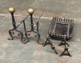 A pair of wrought iron fire dogs with brass ball finials; together with a fire grate, 46cmW and