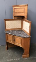 An early 20th century ash marble topped corner washstand, in the style of Morris & Co., with tiled