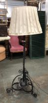 A wrought iron standard lamp, with shade, 150cmH