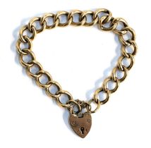 A 9ct gold curb link bracelet with heart shaped padlock, hallmarked for Birmingham, 1978, 17.4g