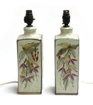 A pair of Colin Kellam (b.1942), studio pottery table lamps, painted with fuchsia design, stamped,