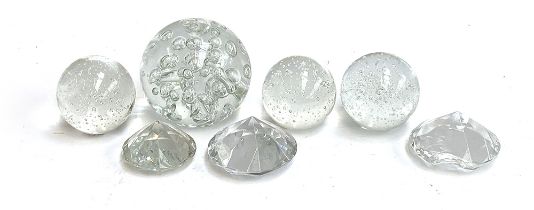 Seven glass paperweights, the largest approx. 13cmD