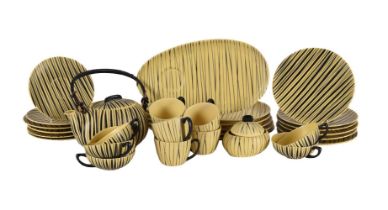 A Tambach Pottery mid century part breakfast service, decorated with black stripes on a yellow