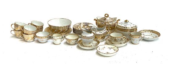 A quantity of 19th century and later white and gilt teawares, to include a greek key pattern part