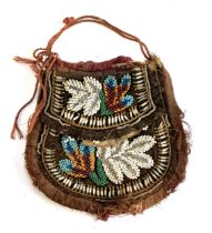 A late 19th century Native American beadwork bag, (af), 17cmW