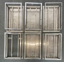 Six large chromed wall lights, all missing glass, each 46x31x16cm