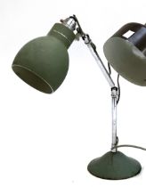 A mid century industrial oposeable lamp, in green