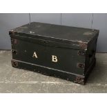 A dark green painted trunk with metal bracing, monogrammed A.B, 87x51x45cmH