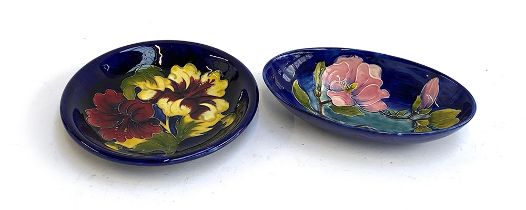 A Moorcroft oblong dish with magnolia pattern, 23.5cmW; together with a further dish, 25cmD (2)