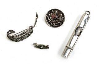 An IONA Scotland silver Viking ship brooch, 2.5cmD; together with a silver and marcasite feather