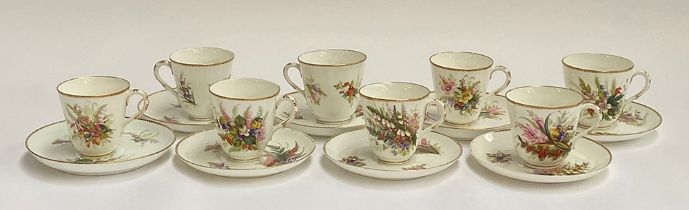 A set of eight early 20th century hand painted porcelain coffee cups and saucers, floral spray