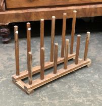 A pine boot rack for six pairs of boots