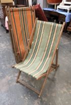 Four vintage beechwood folding deck chairs with striped canvas seats