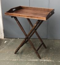 A butlers tray on folding stand, the tray 55x70cm