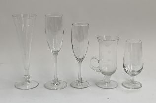 A large quantity of champagne flutes, the tallest 21.5cmH, together with other assorted glasses (2