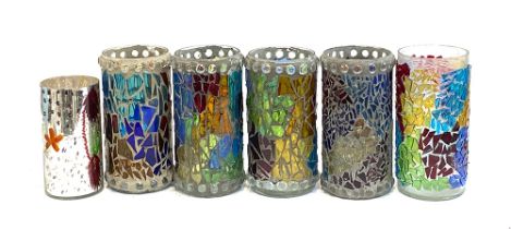 A set of four coloured glass mosaic candle holders, 26cmH; together with two others