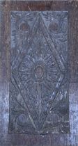A carved oak panel with central diamond pattern, 69x38cm