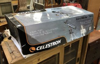 A Celestron AstroMaster 76EQ telescope in box