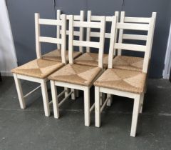 A set of six white painted side chairs with rush seats