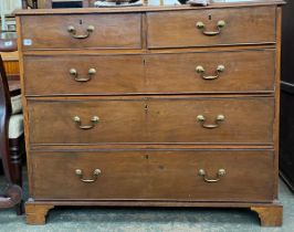 A George III mahogany chest of two short over three graduating drawers, on bracket feet,