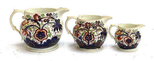 A set of three graduating 19th century lustre jugs (af), 13cmH, 11cmH and 8cmH