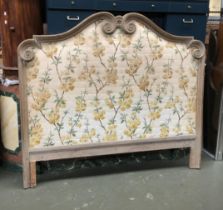 A carved wooden upholstered king sized headboard, 157cmW 140cmH