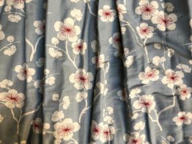 A pair of heavy curtains with white and cerise floral design, lined and interlined (thermal),
